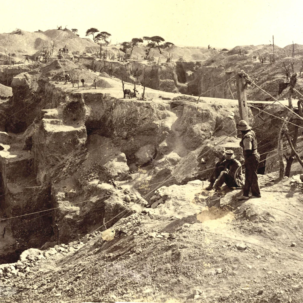 Historic diamond mining site in South Africa showing early extraction methods, highlighting how large diamond discoveries led De Beers to control supply and create the illusion of diamond rarity.