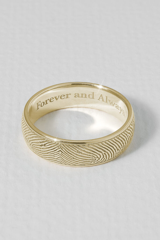 Personalized men’s engagement ring with “Forever and Always” engraving, highlighting emotional and custom jewelry trends.