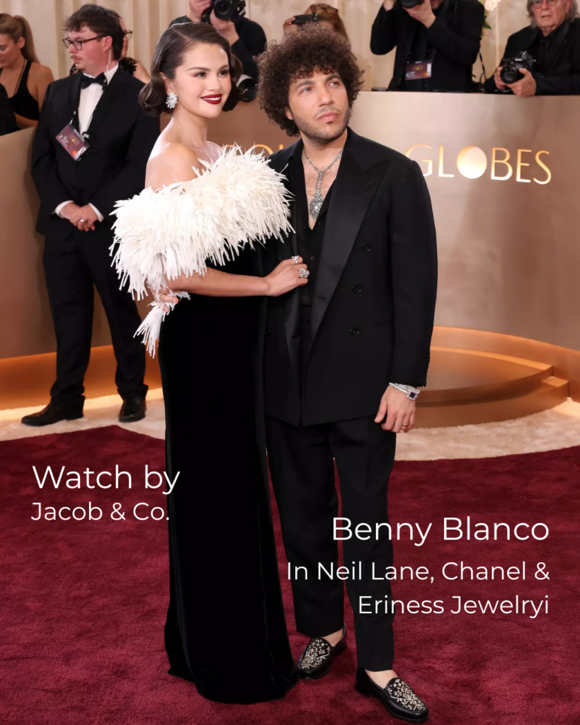 Selena Gomez and Benny Blanco posing on the Golden Globes 2026 red carpet, with Benny Blanco wearing jewelry from Neil Lane, Chanel and Eriness, paired with a Jacob & Co. watch.