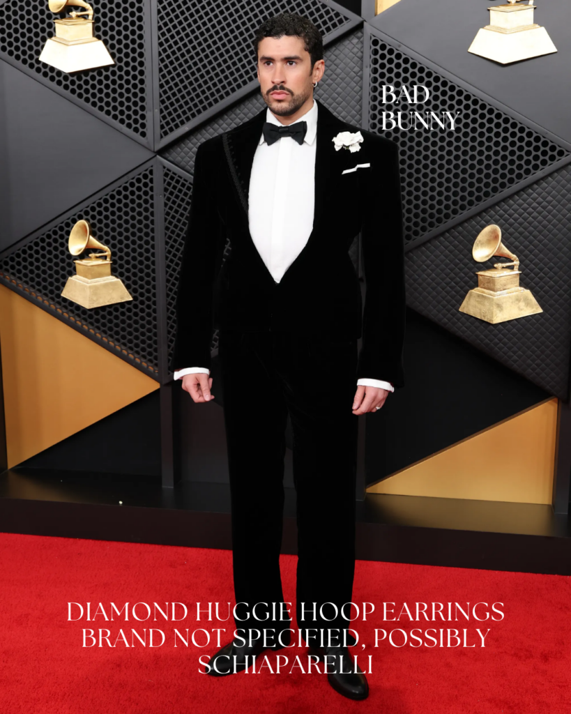 Bad Bunny at the Grammy Awards wearing bold luxury jewelry, featuring diamond rings and statement accessories paired with avant-garde menswear.