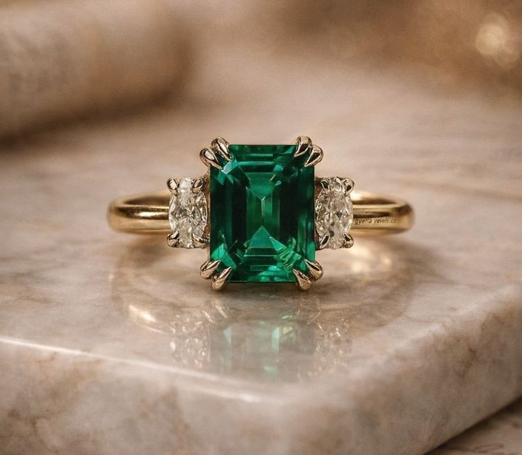 Rich green emerald gemstone for May birthstone in classic ring, representing love, growth, and elegance