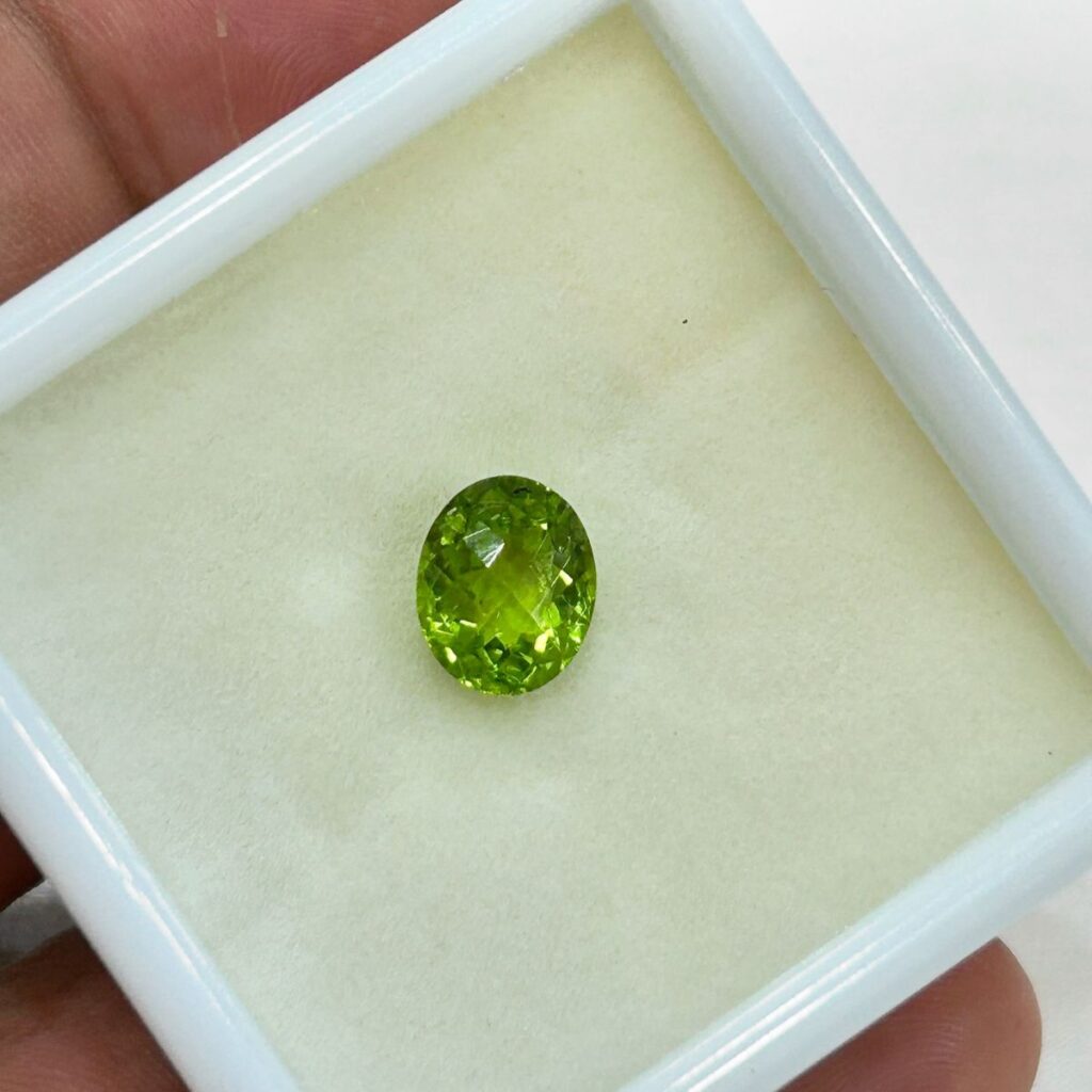 Bright green peridot gemstone for August birthstone in modern jewelry, representing positivity and renewal