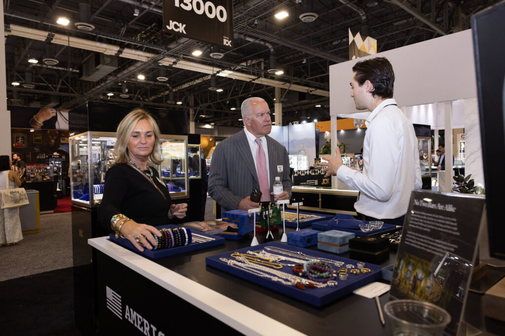 Diamond buyer examining ethical sourcing, certification, and sustainability before purchasing fine jewelry