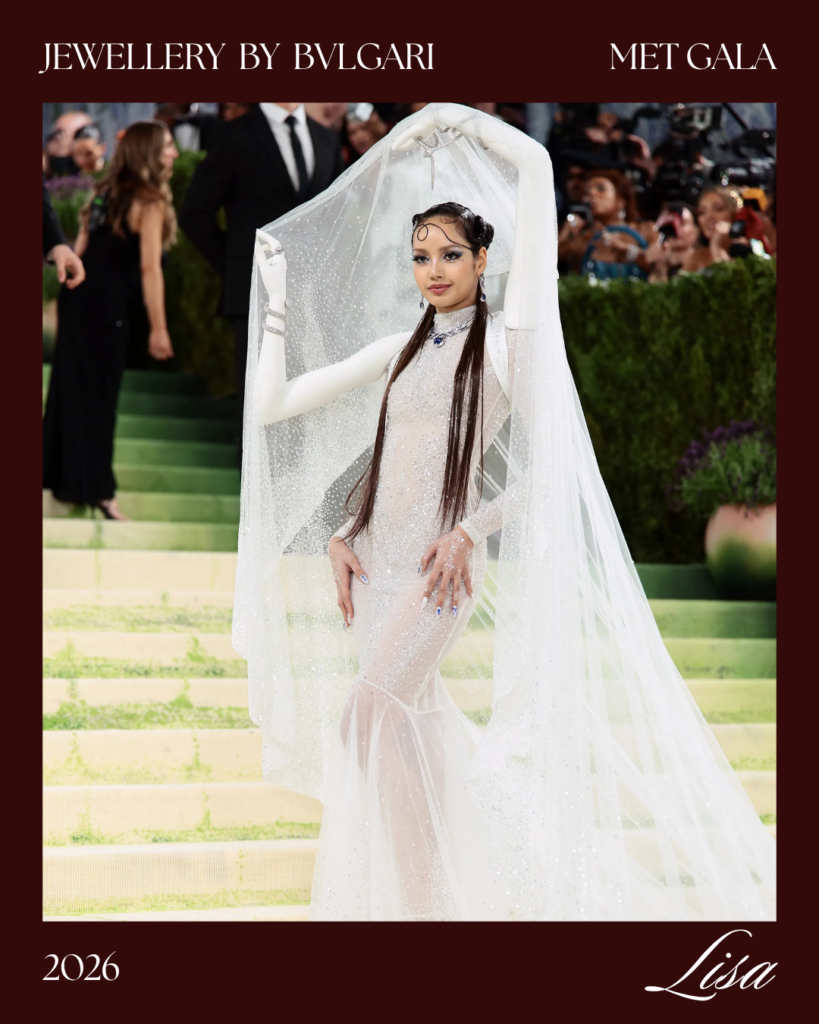 Lisa BLACKPINK Met Gala look 2026 wearing Bulgari High Jewelry 50 carat sapphire necklace with Robert Wun white beaded gown mannequin arms Costume Art red carpet
