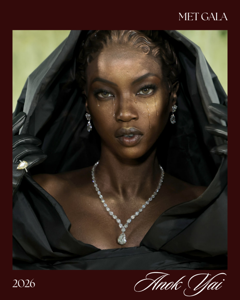  Anok Yai Met Gala look 2026 wearing sculptural gold tears gold shimmer skin custom Balenciaga Couture black hooded gown weeping Madonna inspired Costume Art red carpet