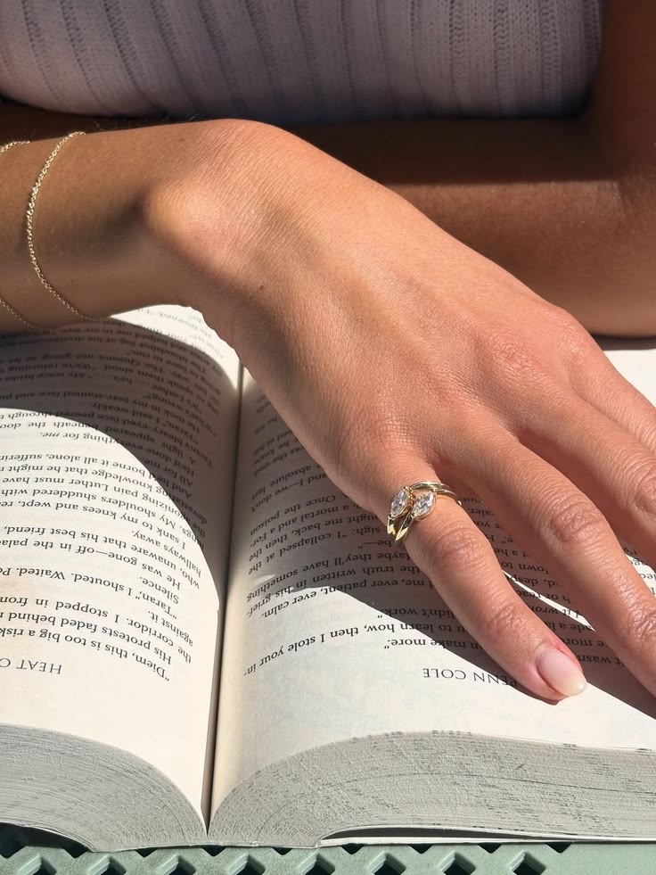 Elegant diamond and gold pinky rings displayed on a woman's hand, showcasing one of the biggest jewelry trends in modern fashion.
