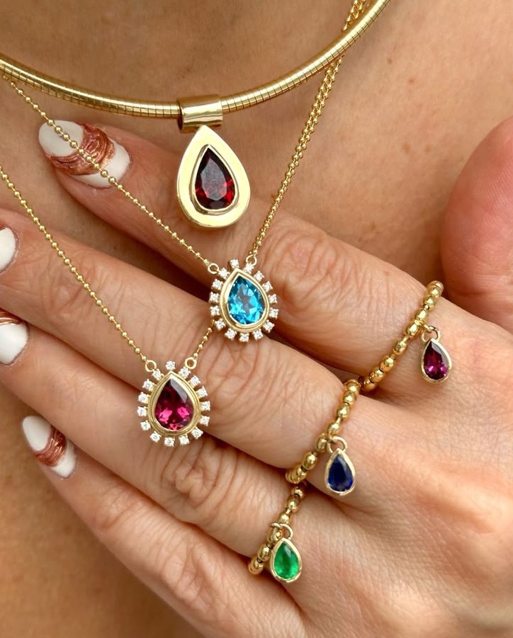 Luxury colored gemstone jewelry featuring emeralds, sapphires, rubies, and tourmalines in modern fine jewelry designs.
