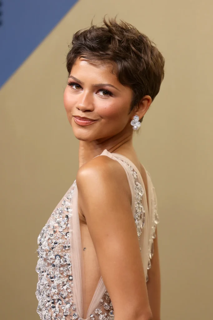 Zendaya wearing Mikimoto pearl jewelry and a Rolex watch at the Emmys 2026, styled with a crystal-embellished custom Prada gown and modern luxury pearl designs from the Petals Collection.